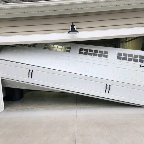 Off-track garage door repair — door off rails Houston TX