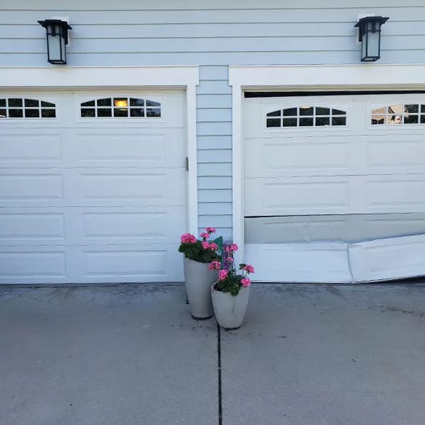 Emergency garage door repair — damaged door panel Houston TX